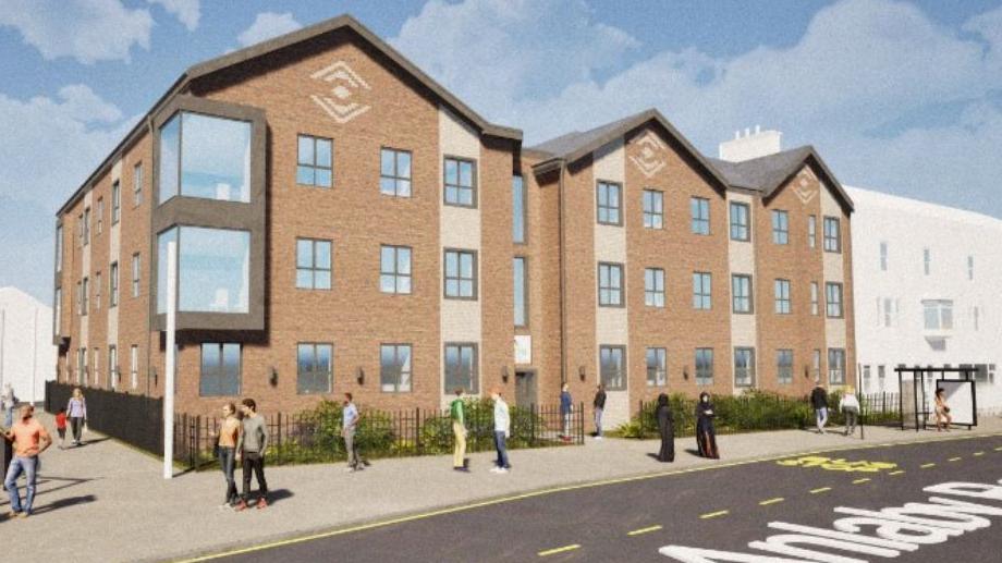 An artist's impression of how the development could look. Three storey brick buildings with 33 windows on the front and further windows on the side.