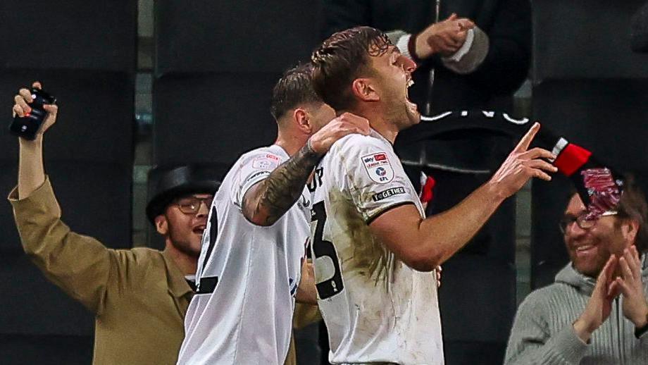 Laurence Maguire scores for MK Dons against Cheltenham