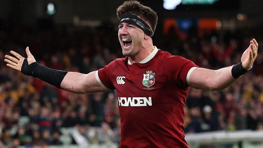 Tom Curry celebrates his try in the second Lions Test against Australia.