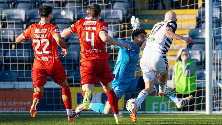 Queen's Park's Zak Rudden scores