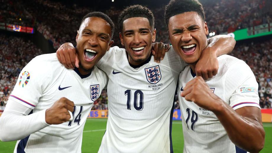 Ezri Konsa, Jude Bellingham and  Ollie Watkins celebrate