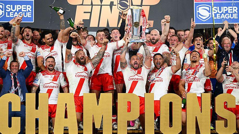 Hull KR players celebrate winning the Super League Grand Final against Wigan