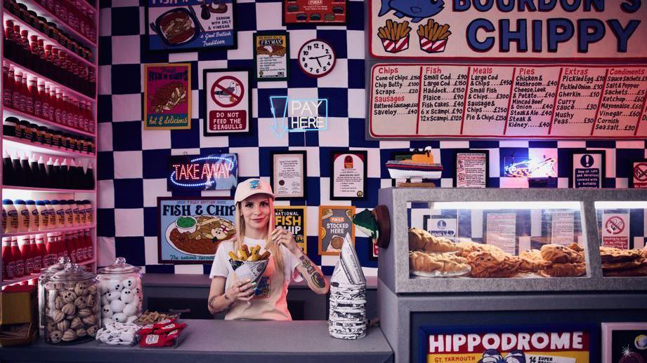 Lucy Sparrow in her hand-stitched felt chip shop 