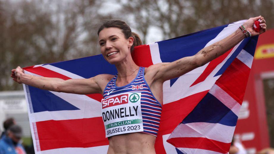 Abbie Donnelly holding a union jack flag