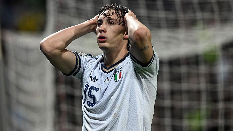 Francesco Esposito holds his hands on his head