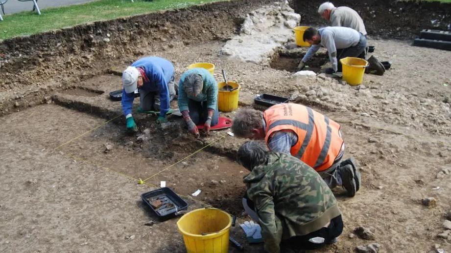 An archaeological dig taking part to uncover remains of a Norman Castle in Chichester's Priory Park