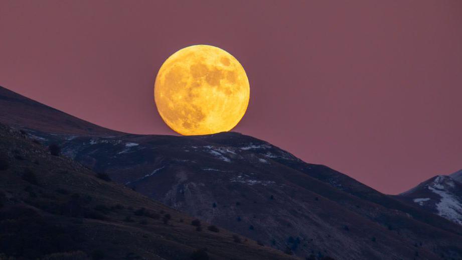 Beaver Moon rising behind Gran Sasso d'Italia