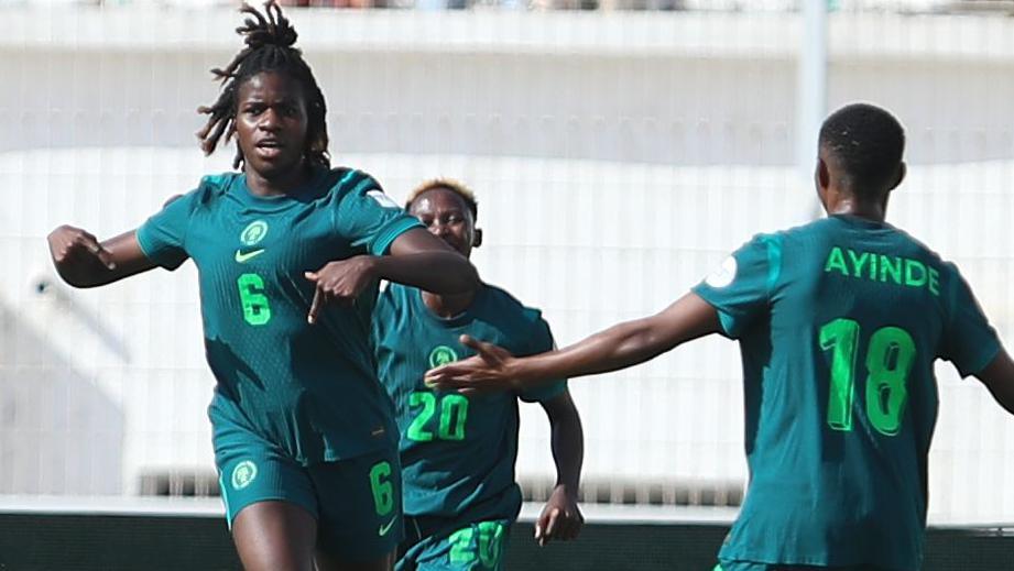 Esther Okoronkwo celebrates a goal with two Nigeria team-mates