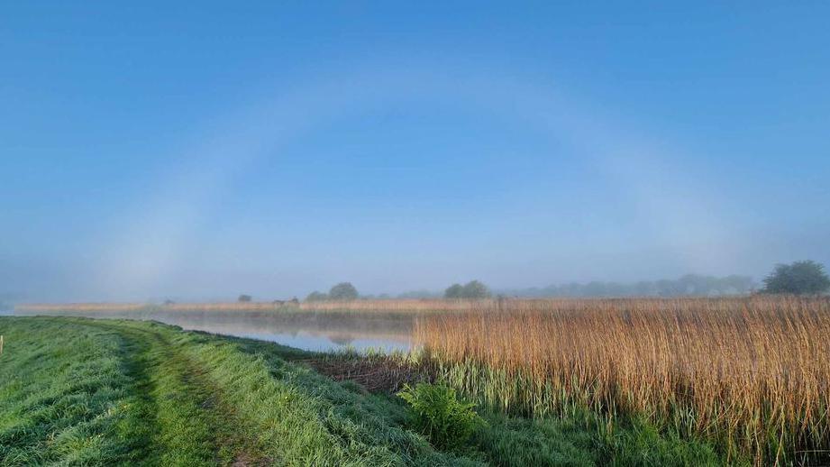 A cloud arc over a river and foot path near Arundel 