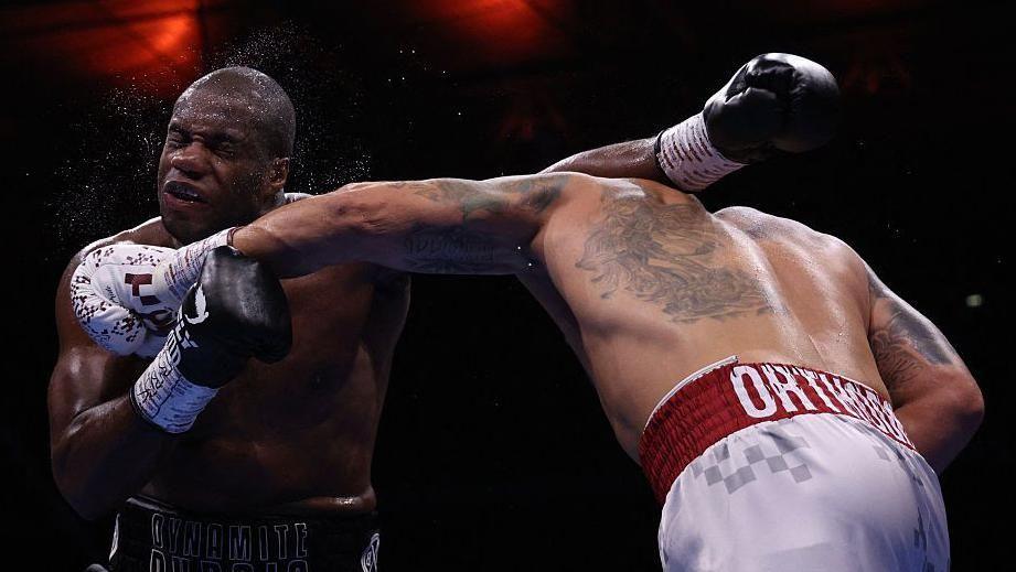 Daniel Dubois is punched by Oleksandr Usyk