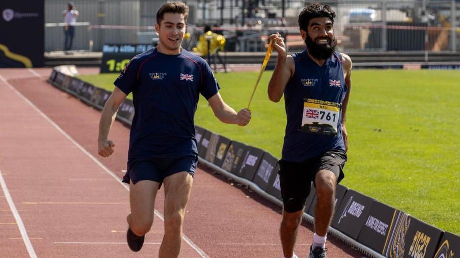 Wali running with a guide runner