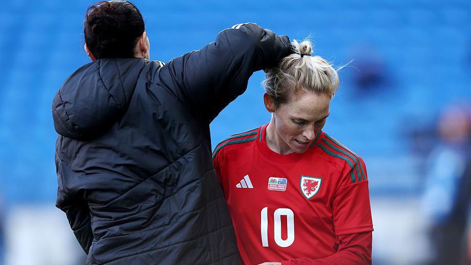 Jerss Fishlock receives a pat from Rhian Wilkinson