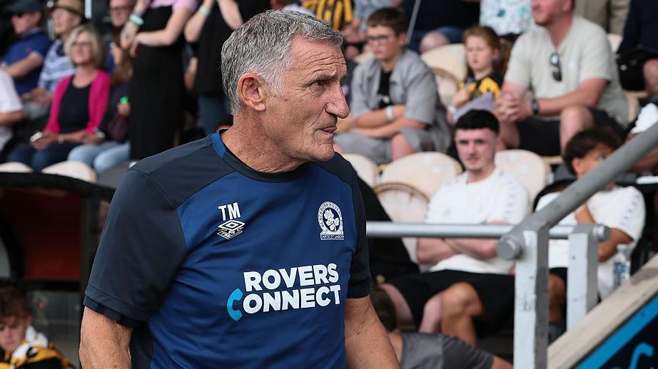 Tony Mowbray heads to the dugout at Ewood Park