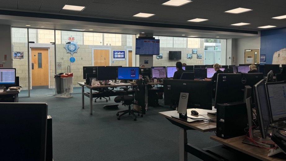 Rows of computers and call handlers in the York control room