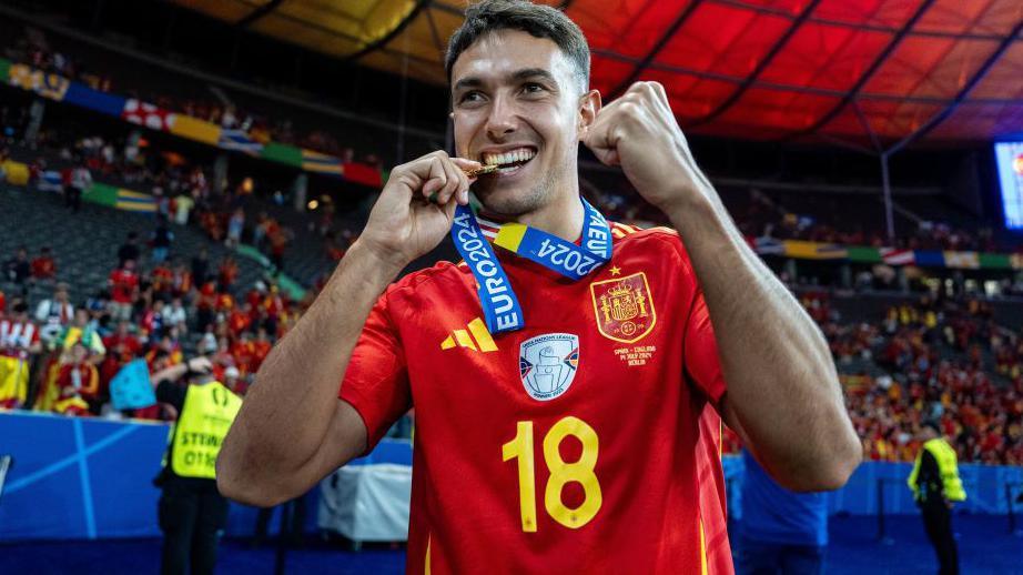 Martin Zubimendi of Spain celebrates with a medal during the Euro 2024 final 