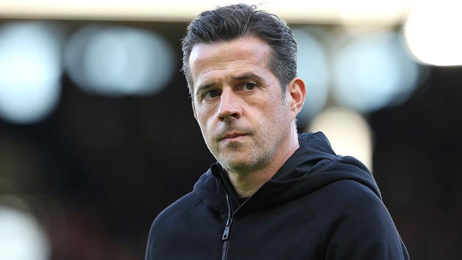 Fulham boss Marco Silva with a thoughtful expression before a match