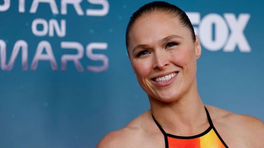 Ronda Rousey smiles on red carpet