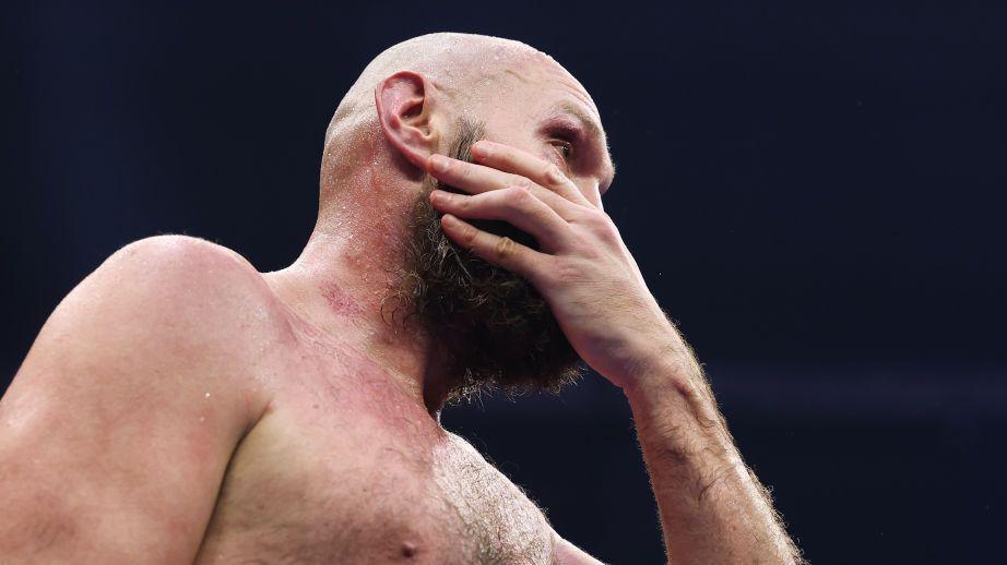 Tyson Fury looks dejected in the ring