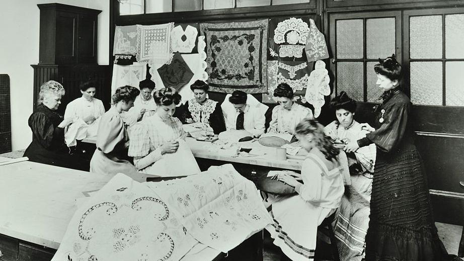 Vintage photograph of affluent women attending a bobbin lace making class in 1902