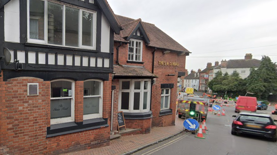 The Stags Head pub in Market Drayton, a red brick building with some black and white timber frames