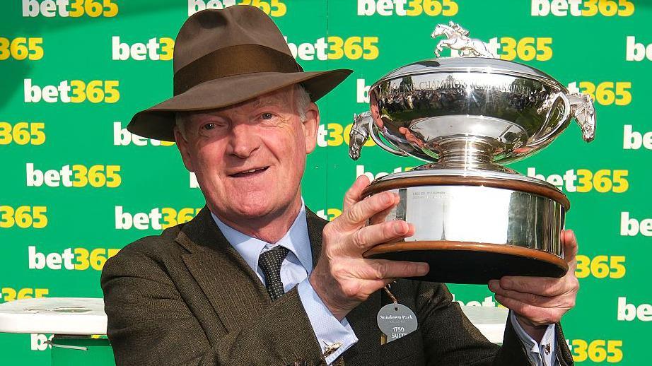Willie Mullins with the champion trainer trophy