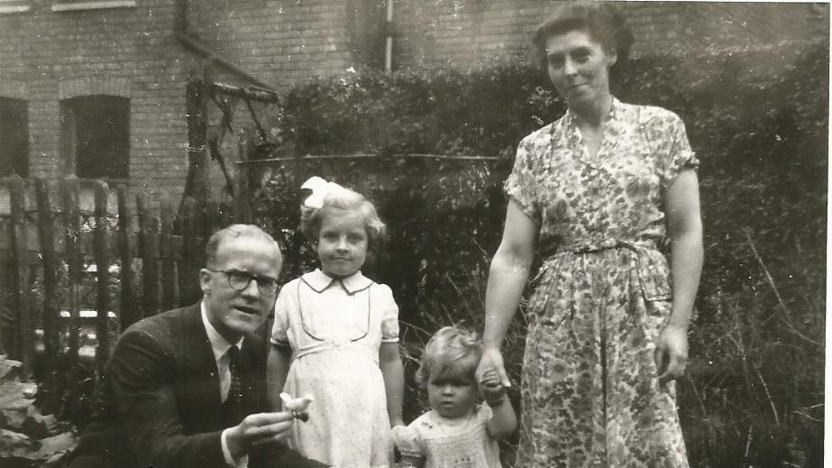 Marjorie with her daughters and husband in 1953 in a garden