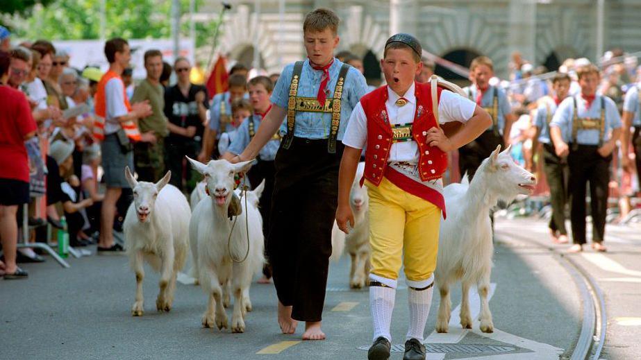 Two boys yodelling at the Yodelling Fetsival in Switzerland 1999.