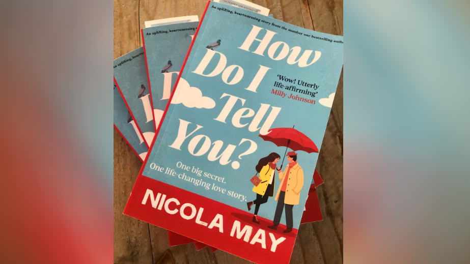 Nicola May book which shows an animated man and women under a red umbrella 