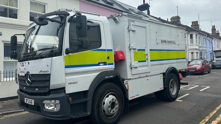 A bomb squad van at the scene