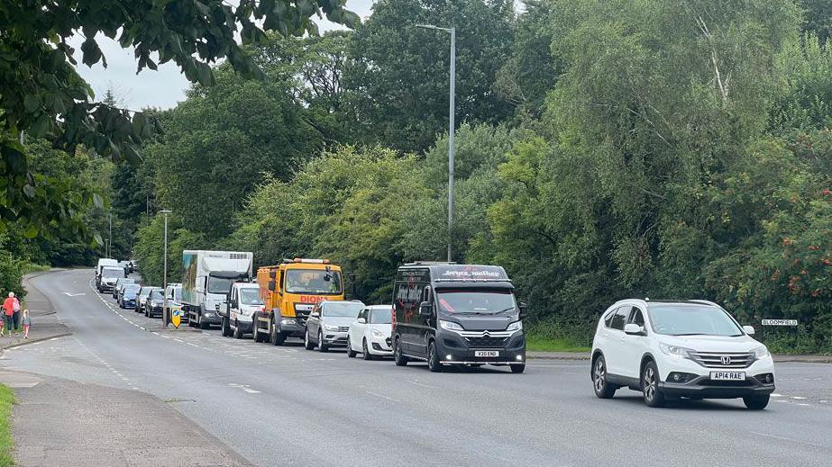 A queue of cars heading along the A701 outside Dumfries