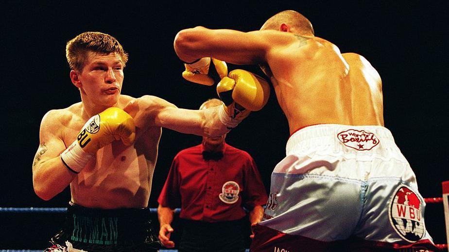 Ricky Hatton lands a punch on the body of his opponent