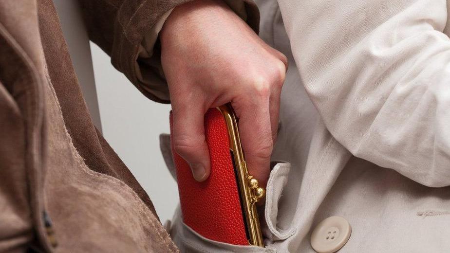 Man taking purse from a pocket