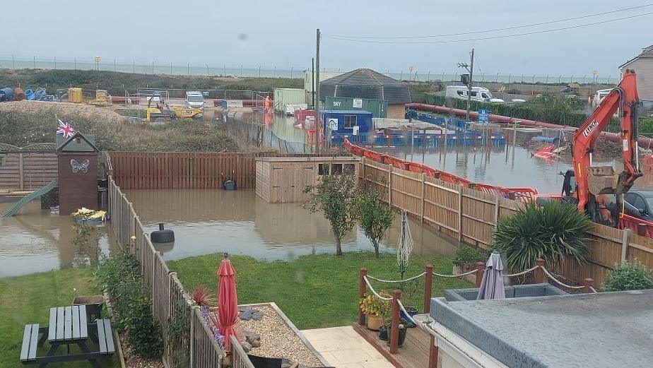 A garden flooded with brown water