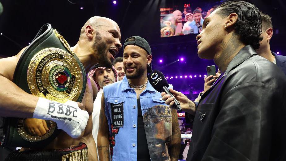 Chris Eubank Jr shouts at Conor Benn with footballer Neymar in the middle of the face-off