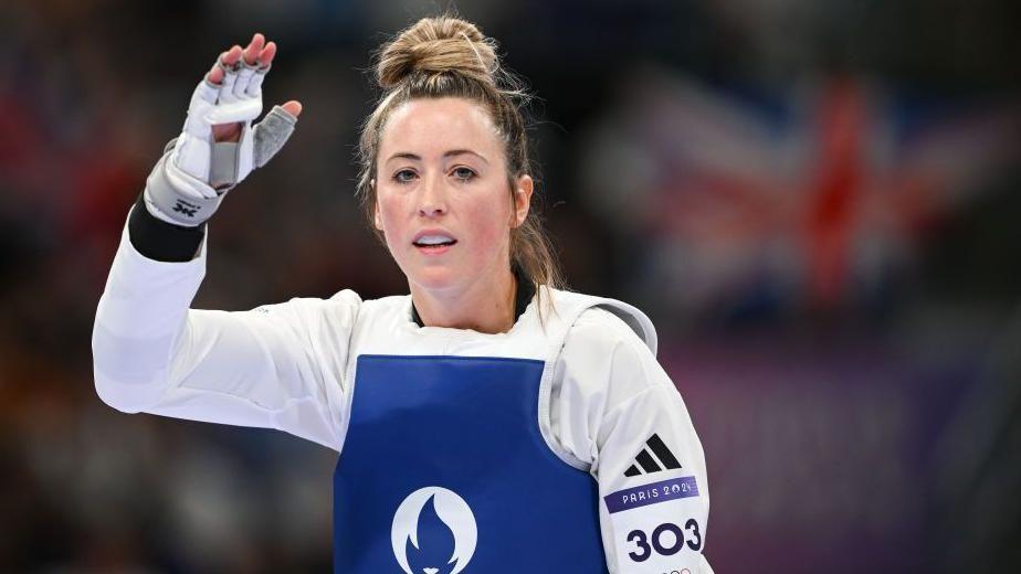 Jade Jones with her arm in the air