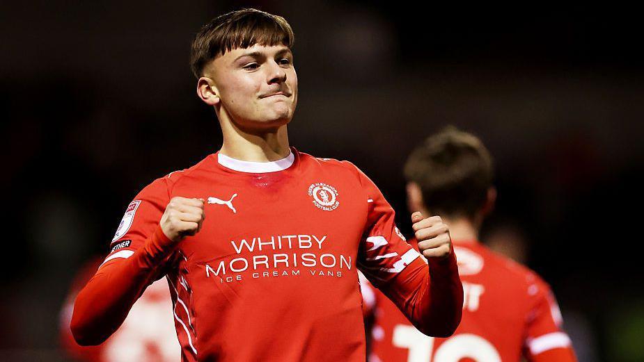 Emre Tezgel celebrates after scoring for Crewe