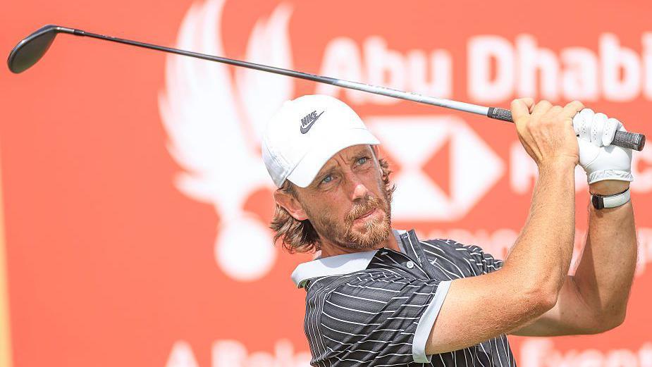 Tommy Fleetwood hitting a golf shot at the Abu Dhabi Championship