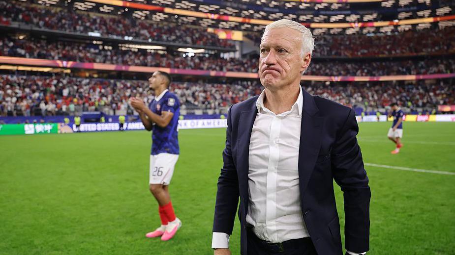 Didier Deschamps looking disappointed as he leaves the field following France's defeat to Spain