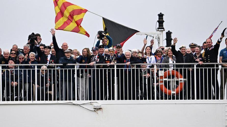 Veterans on Brittany Ferries ship Mont St Michel smiling and waving