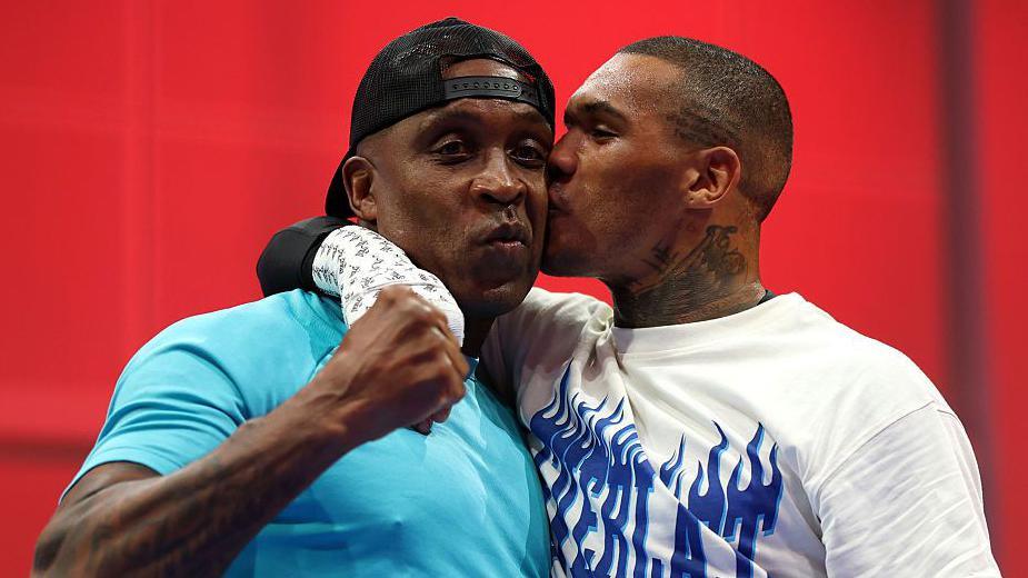 Nigel Benn is kissed by his son Conor Benn