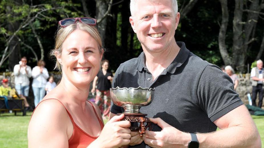 Jacqueline Coull and Ross Ruickbie with trophy