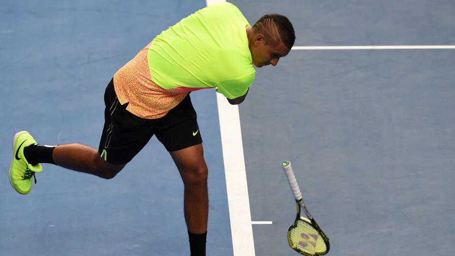 Nick Kyrgios slams his racket to the ground in frustration at the 2015 Australian Open