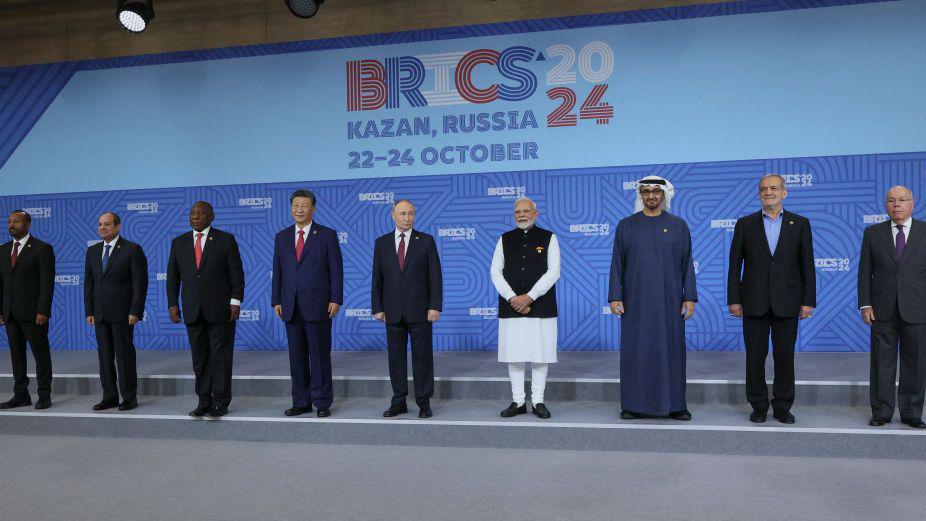 Ethiopian Prime Minister Abiy Ahmed, Egyptian President Abdel Fattah al-Sisi, South African President Cyril Ramaphosa, Chinese President Xi Jinping, Russian President Vladimir Putin, Indian Prime Minister Narendra Modi, The United Arab Emirates' President Sheikh Mohamed bin Zayed Al Nahyan, Iran's President Masoud Pezeshkian and Brazilian Foreign Minister Mauro Vieira pose for a family photo during the BRICS summit in Kazan on October 23, 2024. (Photo by MAXIM SHIPENKOV / POOL / AFP) (Photo by MAXIM SHIPENKOV/POOL/AFP via Getty Images)