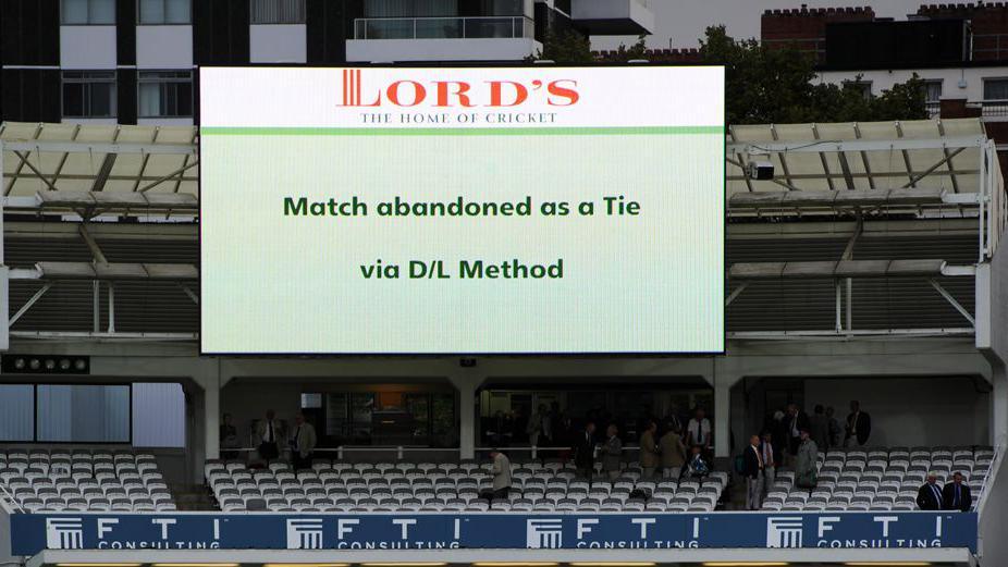 A screen at Lord's cricket ground showing the match was abandoned as a tie via D/L method