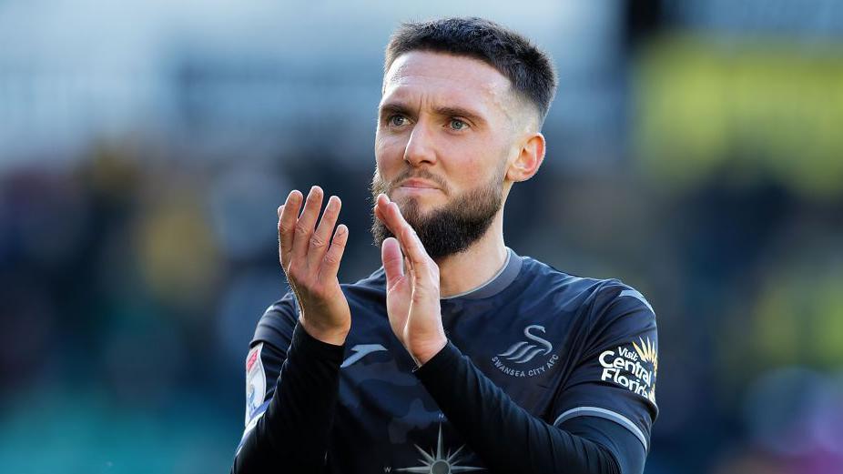 Matt Grimes claps Swansea's fans after defeat at Norwich last weekend