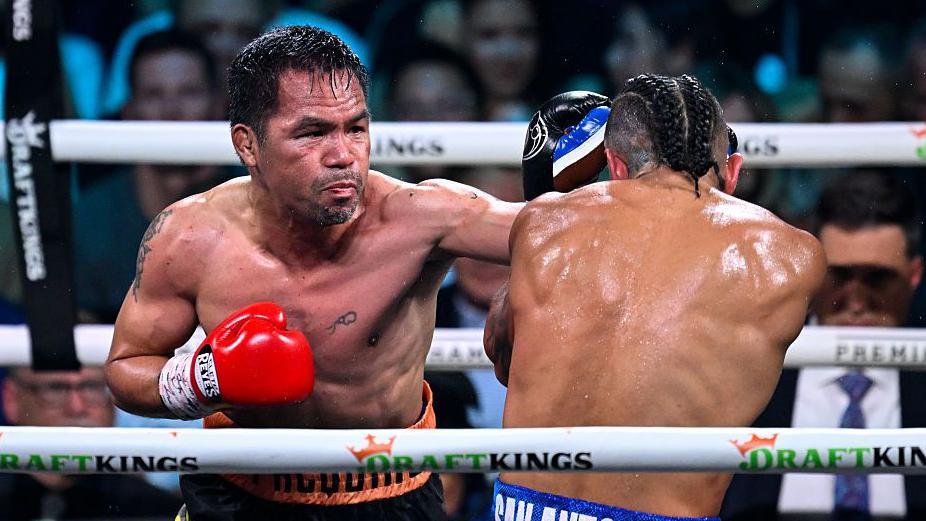 Manny Pacquiao puffs out his cheeks