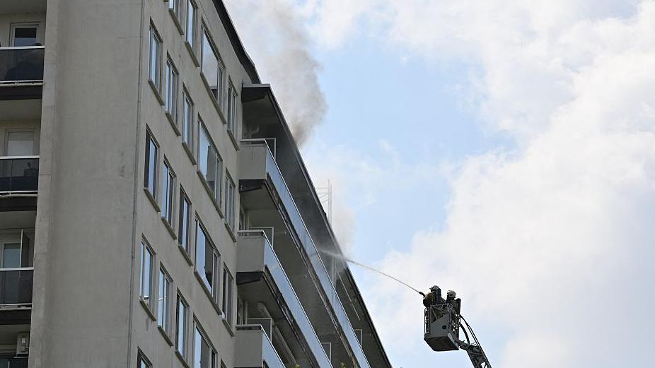 Firefighters pictured at the scene of a fire in an apartment building in the August Vermeylenlaan street in Antwerp on Wednesday 01 July 2026