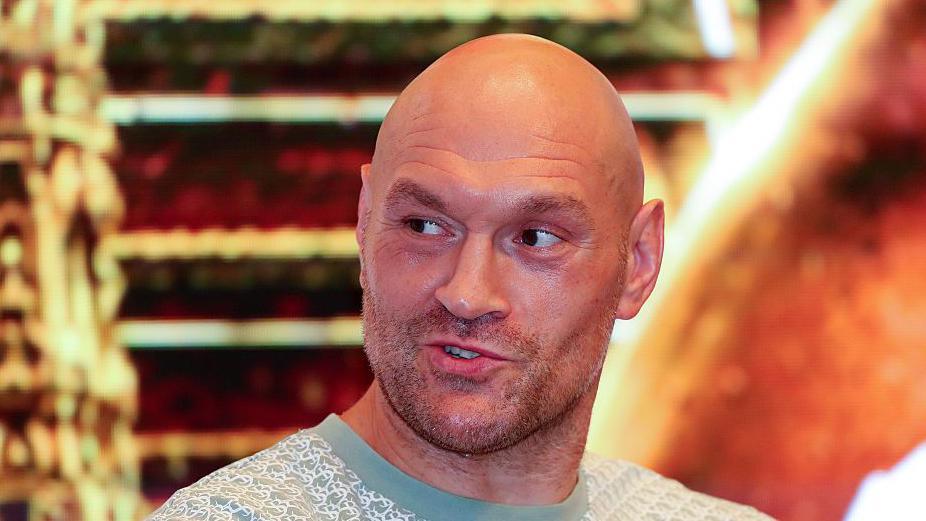 Tyson Fury looking into the distance during a media event in Thailand