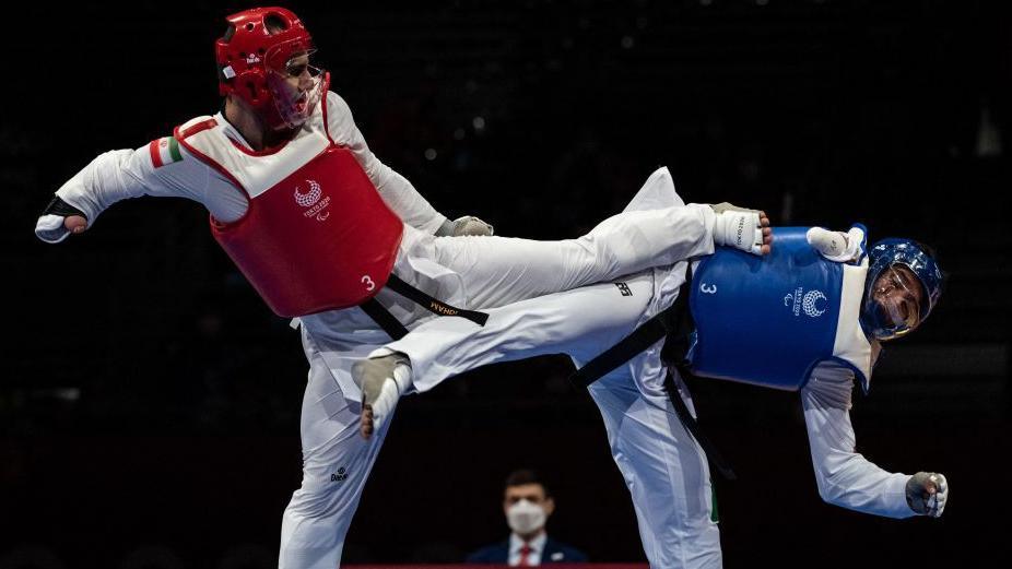 Iran’s Mahdi Pourrahnama goes up against Mexico’s Juan Garcia in the gold-medal bout at the Tokyo Paralympics