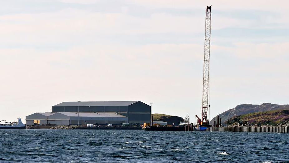 The sheds and a large crane at Arnish, which is on the coast of the Isle of Lewis.